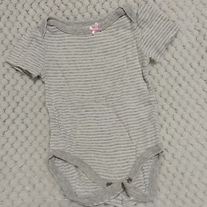 Grey and white striped onsie with a pink bow